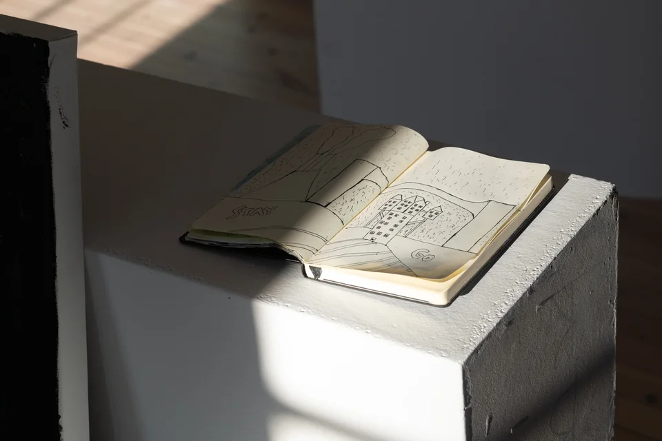 Sunlight across an open STAY and GO notebook